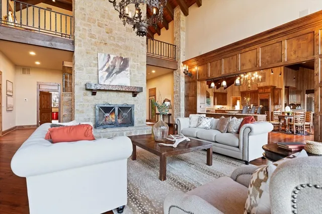 a large kitchen with stainless steel appliances granite countertop a sink and cabinets