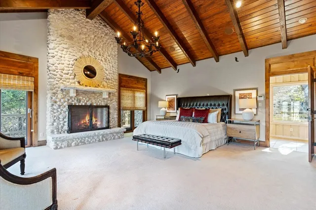 a living room with furniture rug and wooden floor