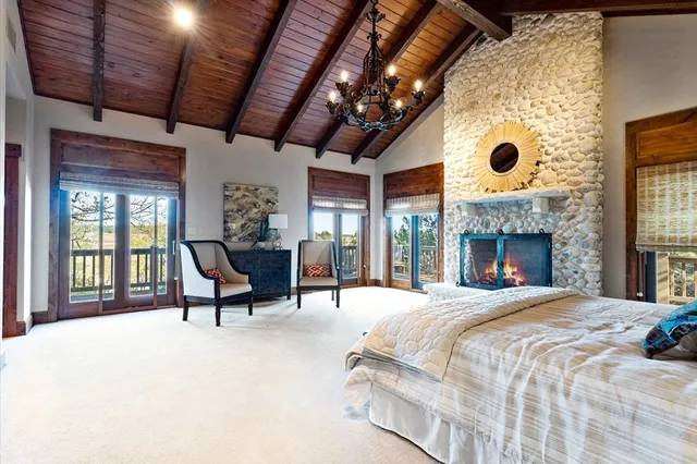 a living room with furniture a fireplace and a table