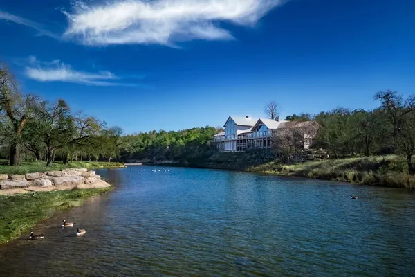 a view of a lake with a yard
