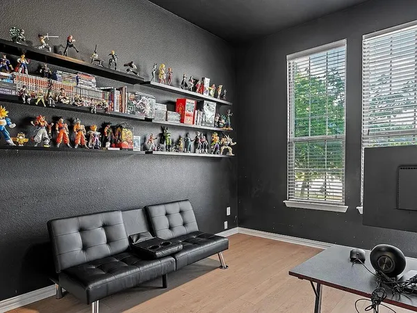 a livingroom with workspace and a window