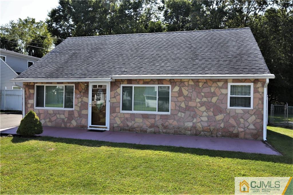 61 Ashley Road Edison, NJ 08817 - Photo 1 of 25 a house view with a garden space