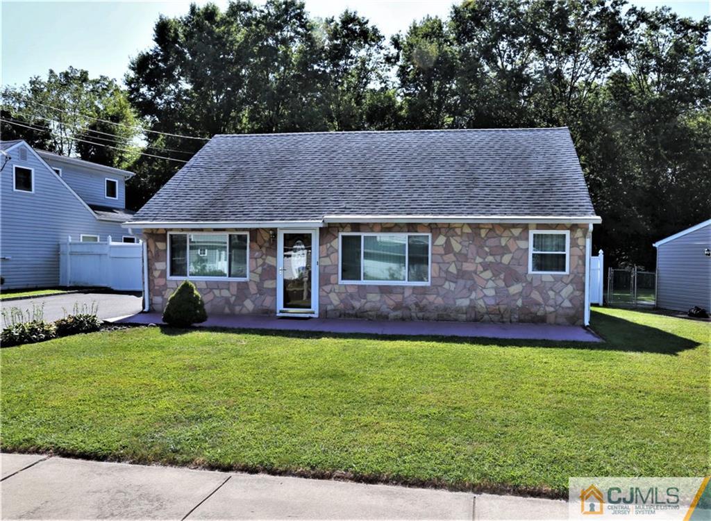 61 Ashley Road Edison, NJ 08817 - Photo 2 of 25 a front view of a house with a garden