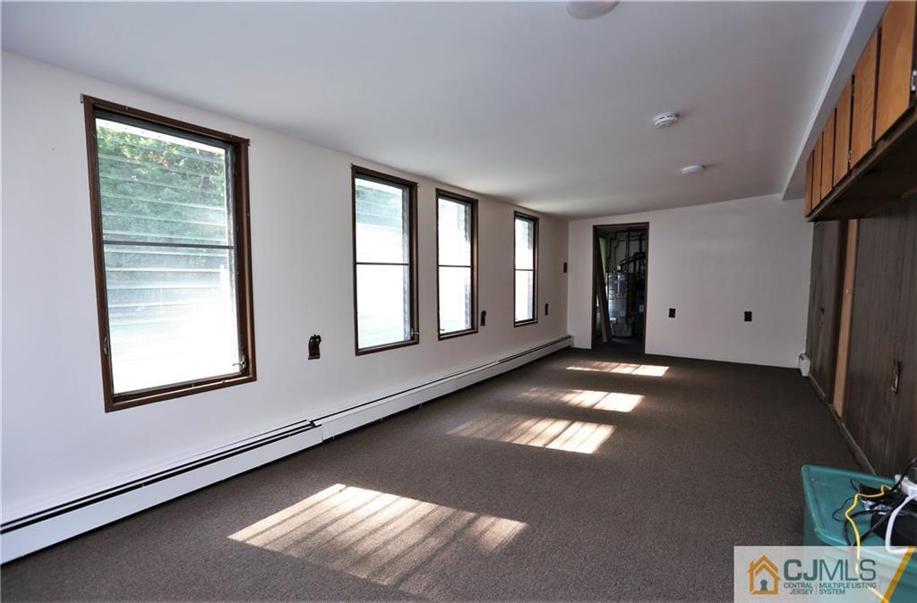 61 Ashley Road Edison, NJ 08817 - Photo 13 of 25 a view of an empty room with a window