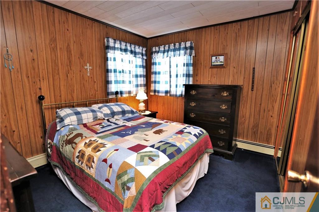 61 Ashley Road Edison, NJ 08817 - Photo 14 of 25 a bedroom with a bed and a window