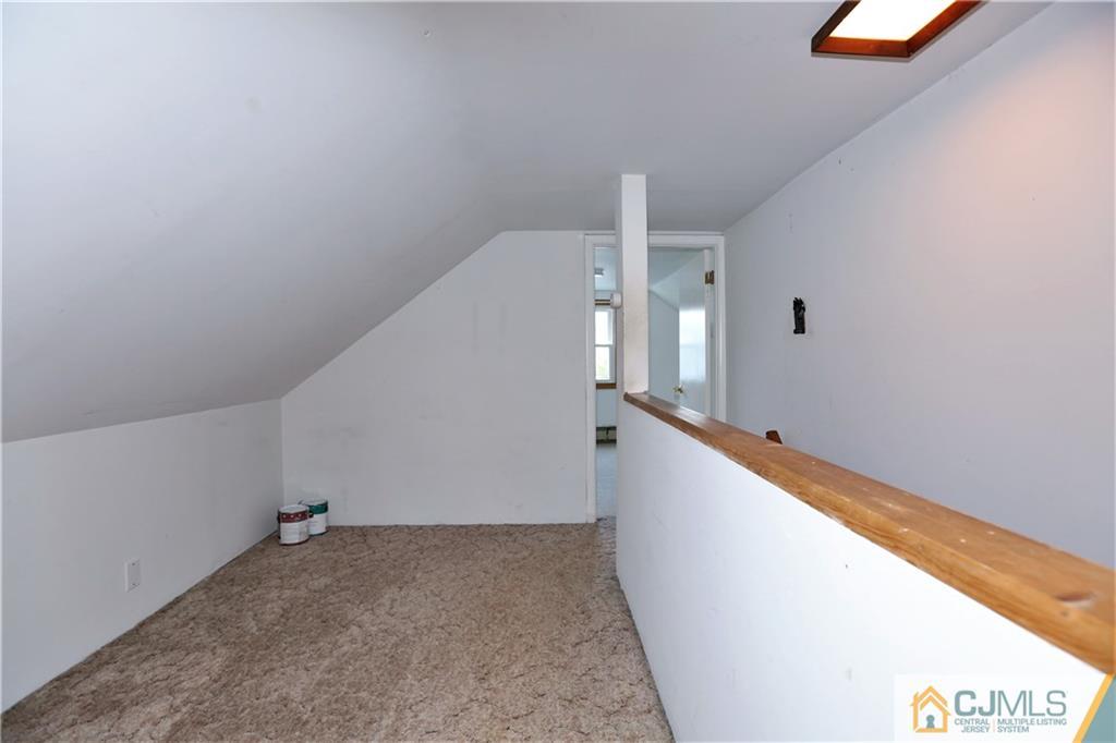 61 Ashley Road Edison, NJ 08817 - Photo 19 of 25 a view of a hallway with staircase