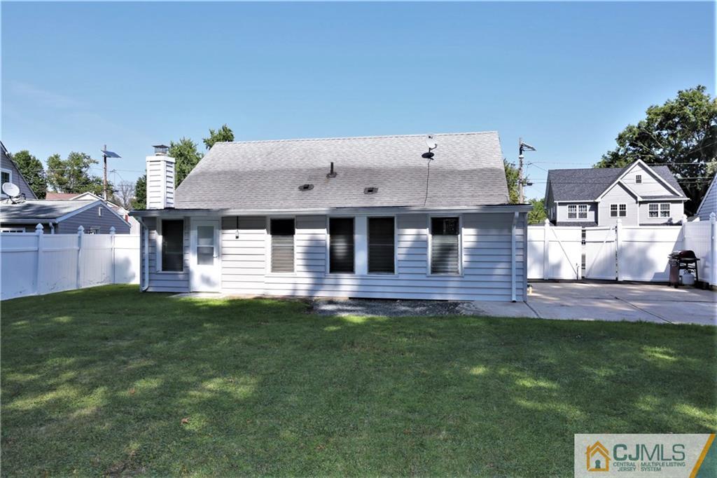 61 Ashley Road Edison, NJ 08817 - Photo 23 of 25 a front view of a house with a garden