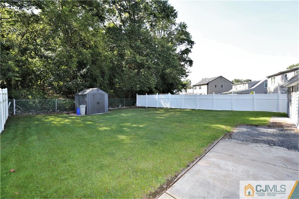 61 Ashley Road Edison, NJ 08817 - Photo 24 of 25 a view of a backyard with a garden and plants