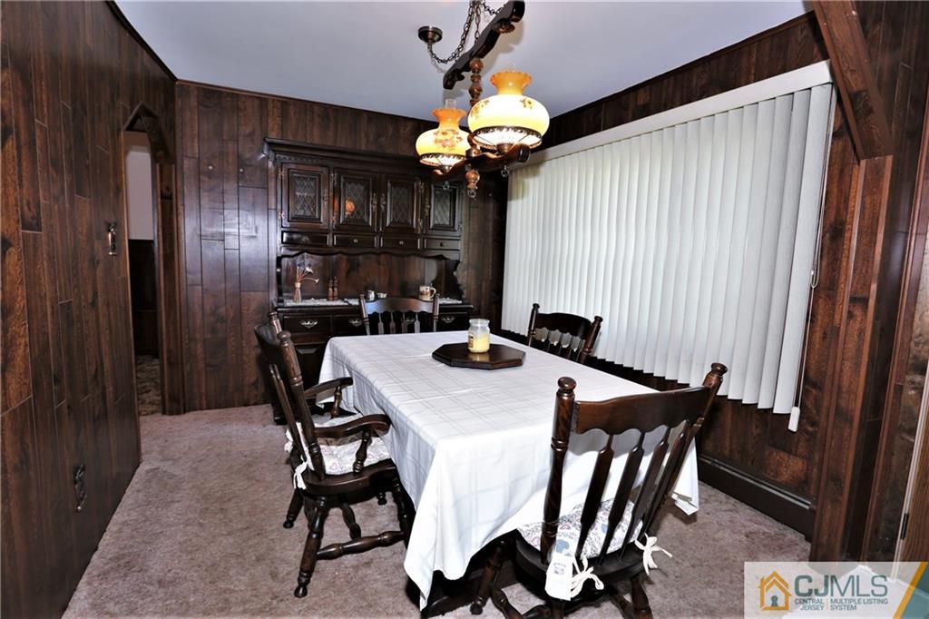61 Ashley Road Edison, NJ 08817 - Photo 6 of 25 a view of a dining room with furniture and chandelier