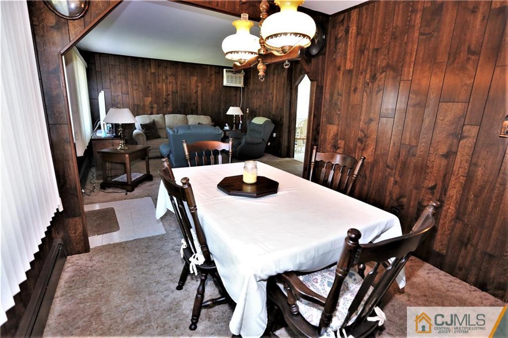 61 Ashley Road Edison, NJ 08817 - Photo 7 of 25 a view of a dining room with furniture and chandelier