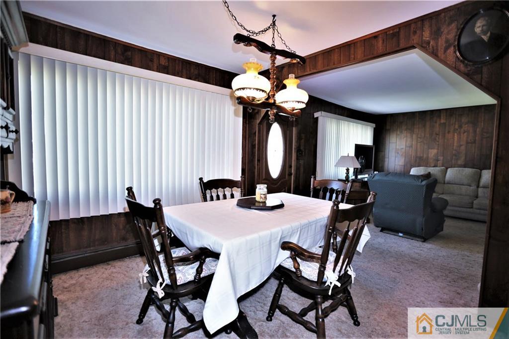 61 Ashley Road Edison, NJ 08817 - Photo 8 of 25 a view of a dining room with furniture and chandelier
