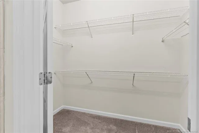 a view of a room with window and wooden floor