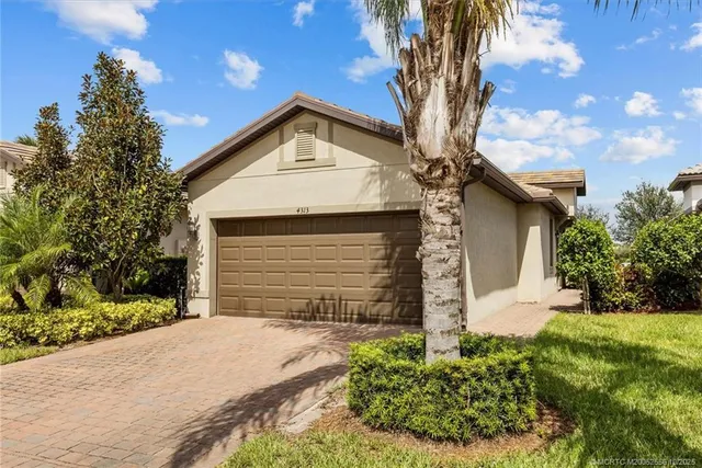 an aerial view of a house with a garden