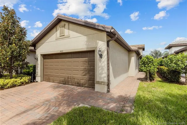 an aerial view of residential houses with outdoor space and swimming pool