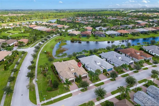 an aerial view of a house with a lake view