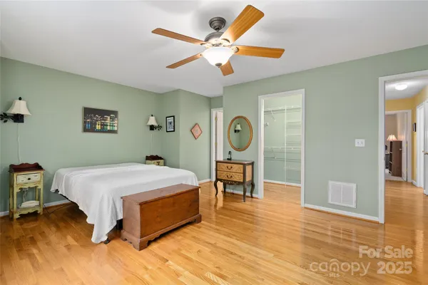 a bed room with a bed and a window