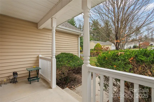 a view of a chair and table in the balcony