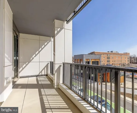 a view of balcony with wooden floor and fence