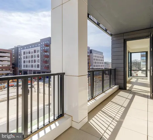 a view of balcony with wooden floor