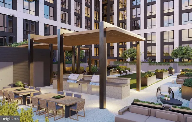 a view of a building and a couches in the patio