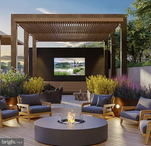 a outdoor living space with furniture and a fireplace