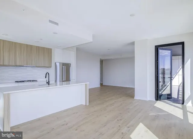 a view of a kitchen with a sink cabinets and a window