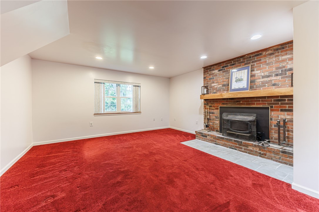 53 Guildhall Road Rochester, NY 14623 - Photo 11 of 35 LArge Family Room with spectacular fireplace to keep you cozy on cold winter evenings.