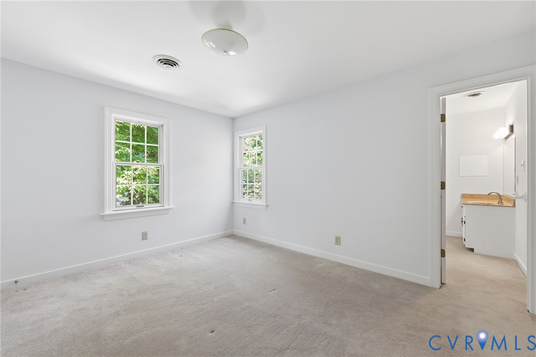 3201 East Brigstock Road Midlothian, VA 23113 - Photo 43 of 72 an empty room with windows