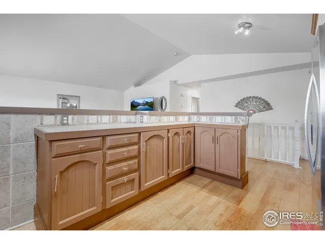 a kitchen with stainless steel appliances granite countertop a stove a refrigerator and a microwave