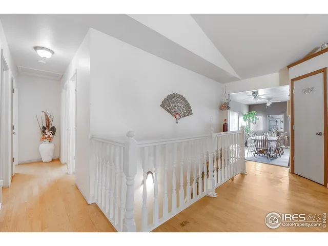 a living room with a bed and a chandelier