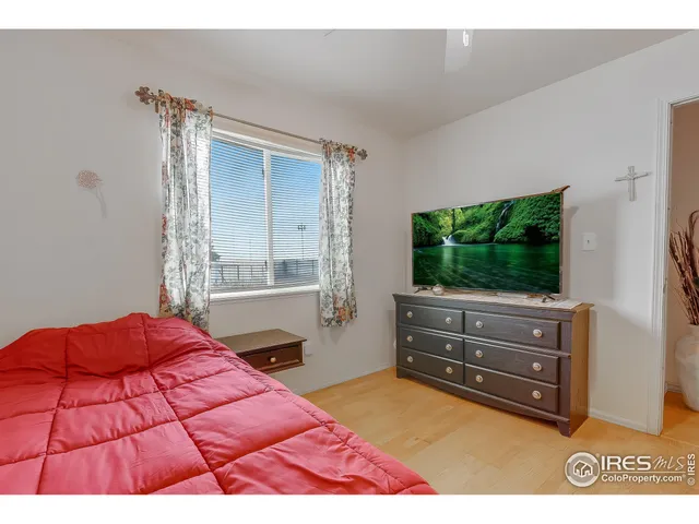 a bathroom with a sink a toilet a mirror and shower
