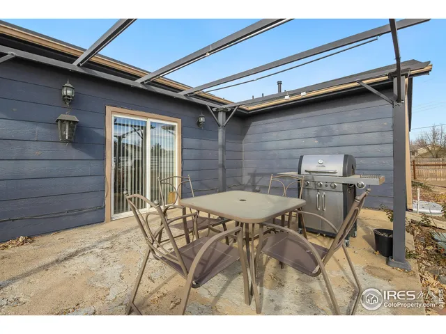 a view of a house with wooden fence