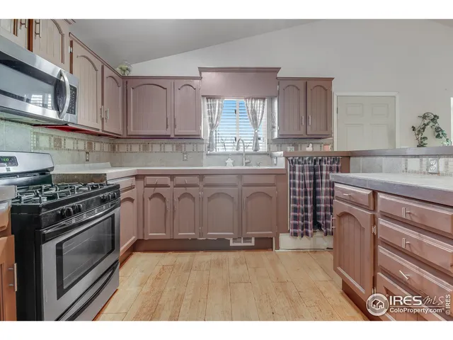 a kitchen with a cabinets and chandelier