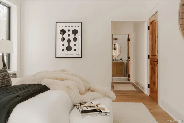 a bedroom with a bed and a couch