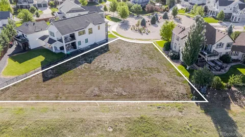 a view of swimming pool with seating area