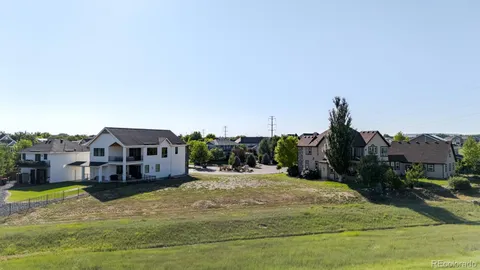 a swimming pool with buildings in the background