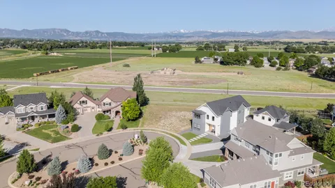 an aerial view of a house with a lake view