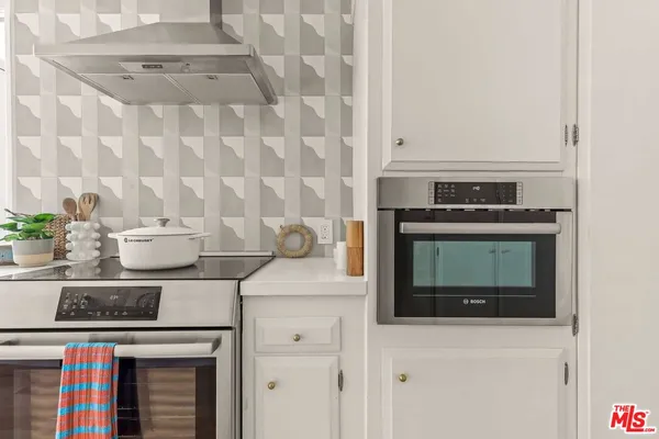 a close view of two chairs and a table in a kitchen