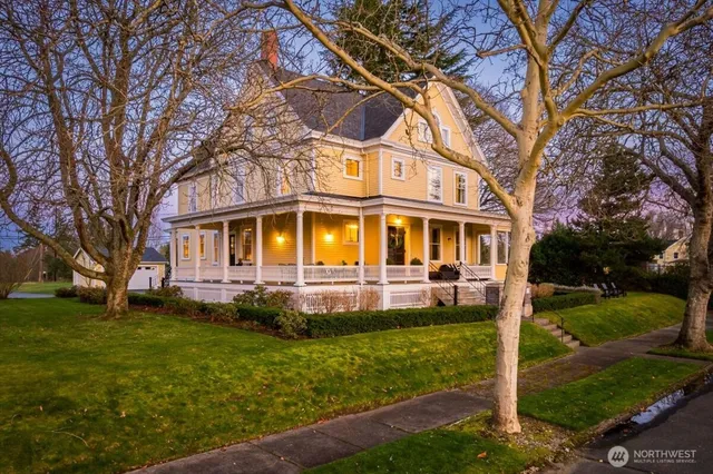 a front view of a house with a yard table and chairs