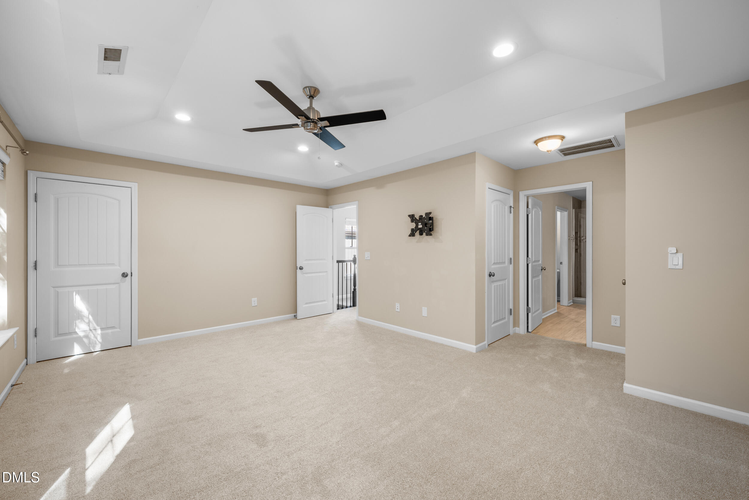 1217 Silver Beach Way Raleigh, NC 27606 - Photo 19 of 32 a view of an empty room and a ceiling fan
