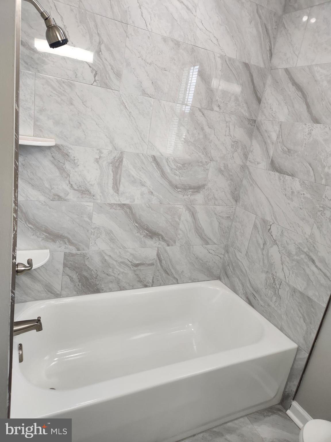 4113 Century Road Baltimore, MD 21206 - Photo 11 of 27 a bathroom with a bathtub