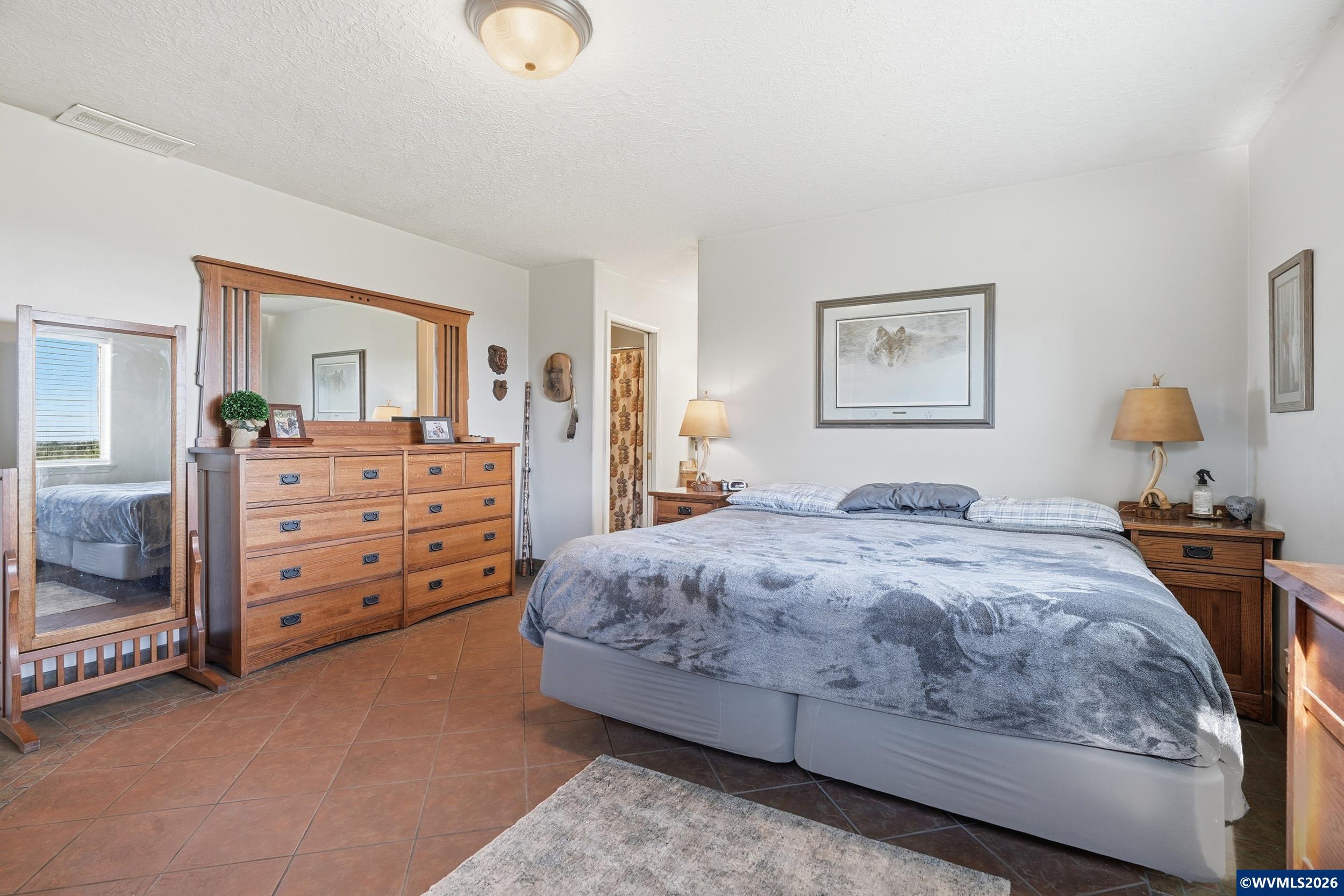 1110 Reuben Boise Road Dallas, OR 97338 - Photo 21 of 49 a bedroom with a bed and dresser
