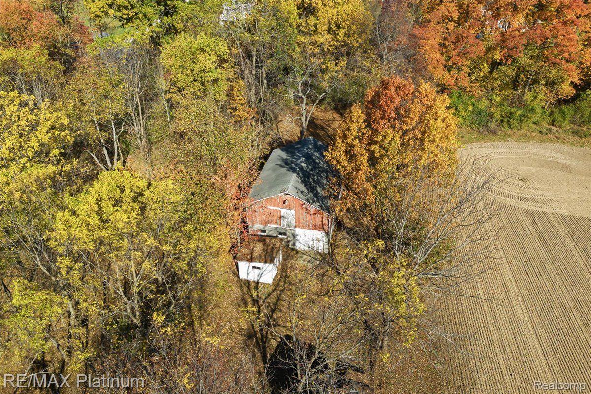 1215 South Bull Run Road Fowlerville, MI 48836 - Photo 49 of 80 The barn and structures awaiting their function.