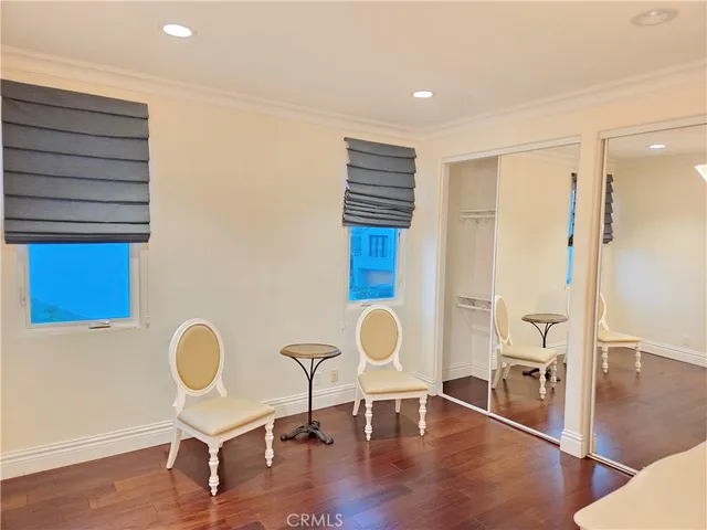 a view of a chair and tables in the patio