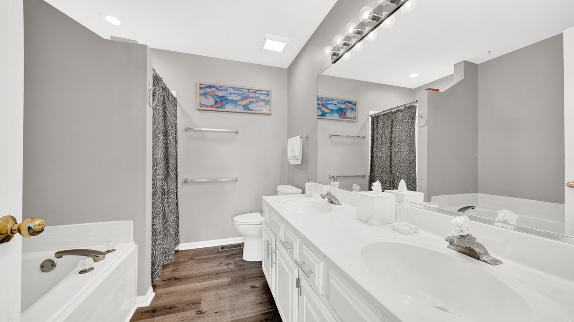 Undisclosed Address Palatine, IL 60067 - Photo 20 of 27 a bathroom with a double vanity sink mirror and toilet