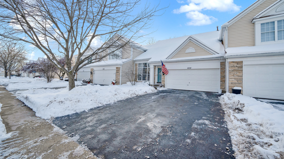 Undisclosed Address Palatine, IL 60067 - Photo 2 of 27 a view of garage and white house