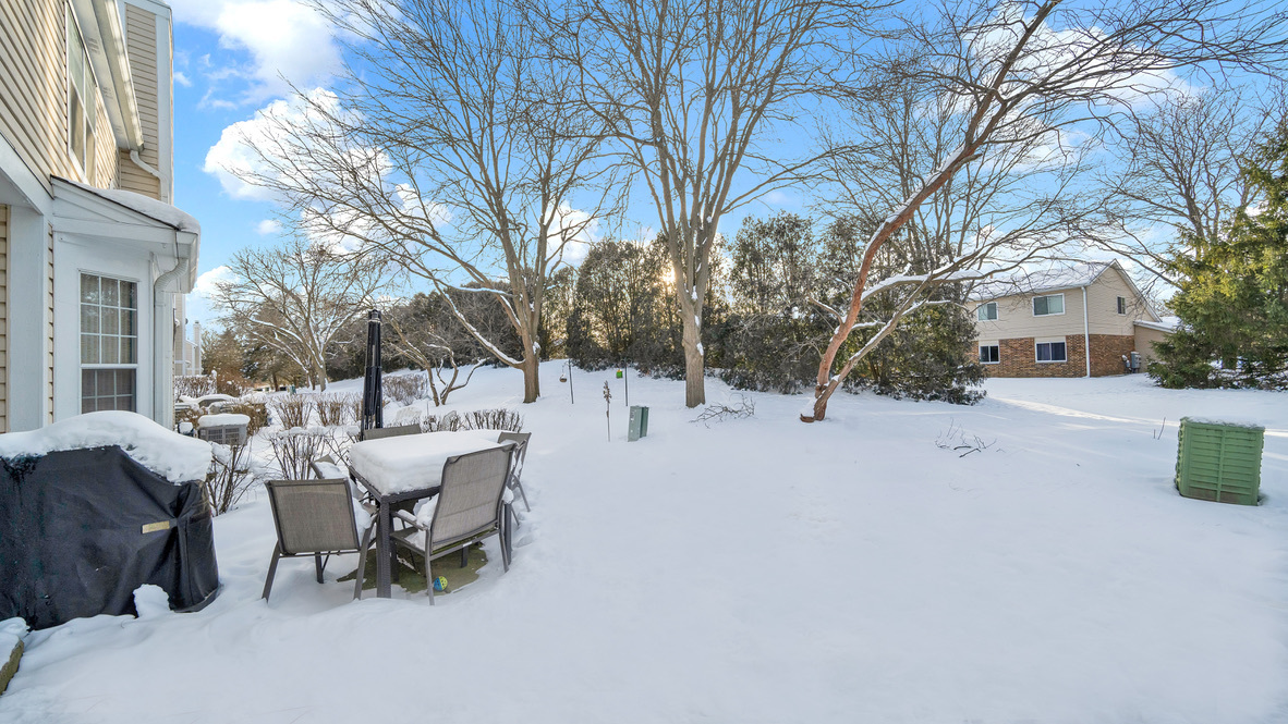 Undisclosed Address Palatine, IL 60067 - Photo 27 of 27 a view of backyard with table and chairs and a fire pit
