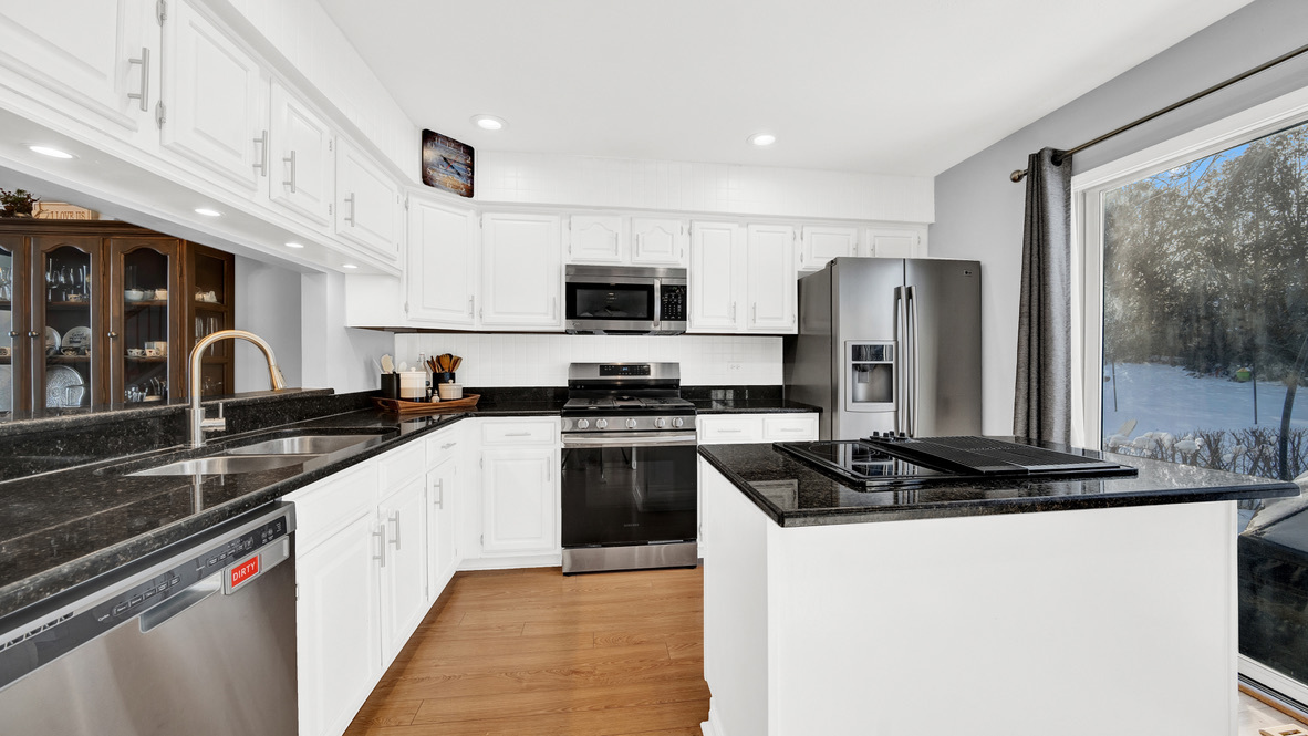 Undisclosed Address Palatine, IL 60067 - Photo 6 of 27 a kitchen with stainless steel appliances a sink stove and refrigerator
