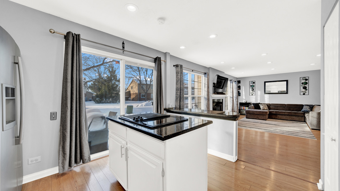 Undisclosed Address Palatine, IL 60067 - Photo 8 of 27 a kitchen with granite countertop a stove and a sink
