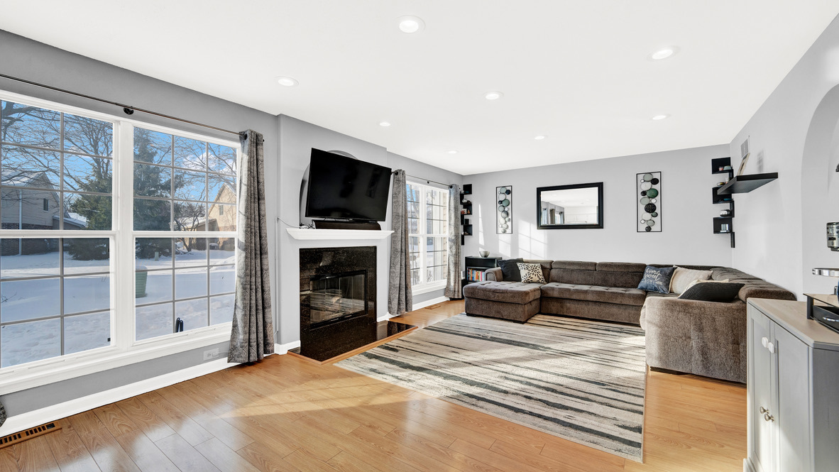 Undisclosed Address Palatine, IL 60067 - Photo 9 of 27 a bedroom with a bed a fireplace and a television